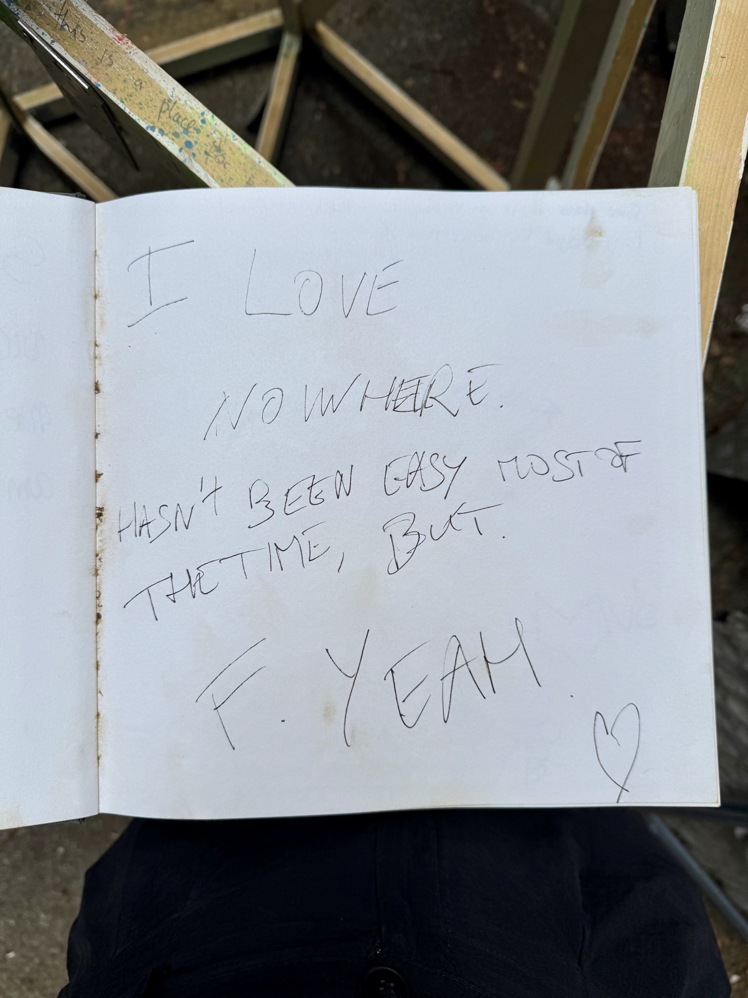 A page from the book with handwritten messages from visitors