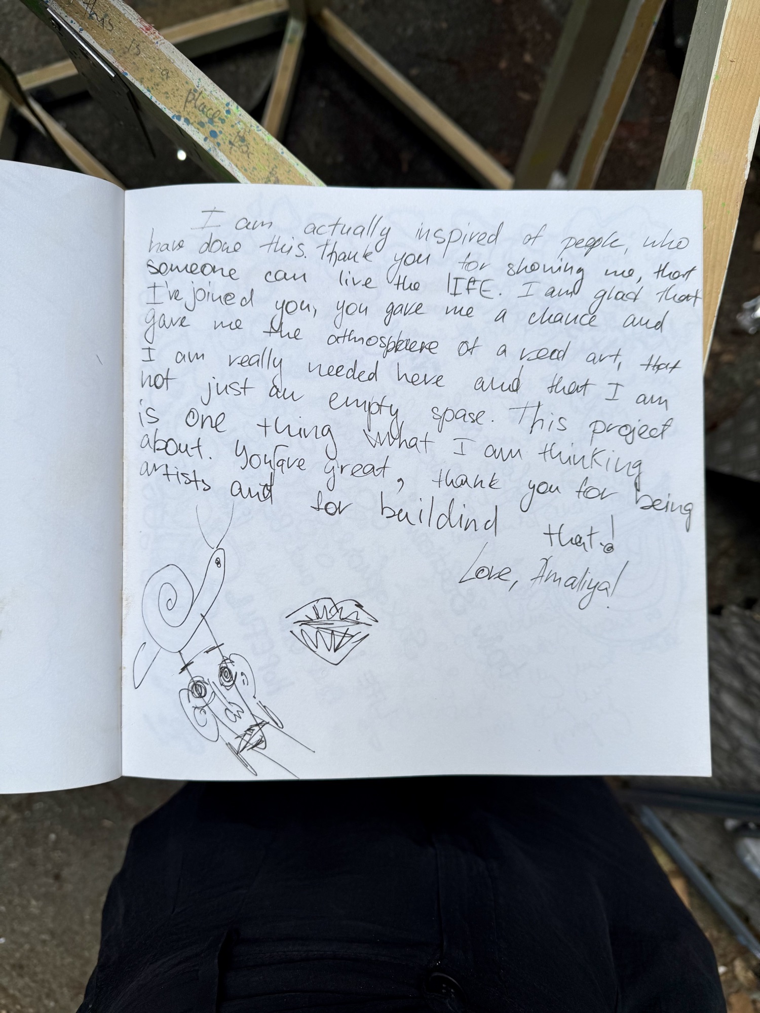 A page from the book with handwritten messages from visitors