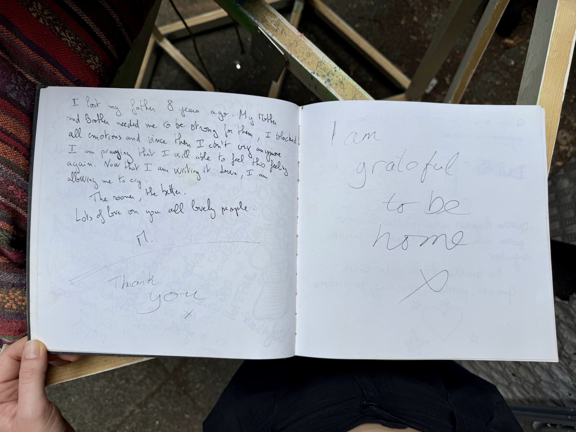 A page from the book with handwritten messages from visitors