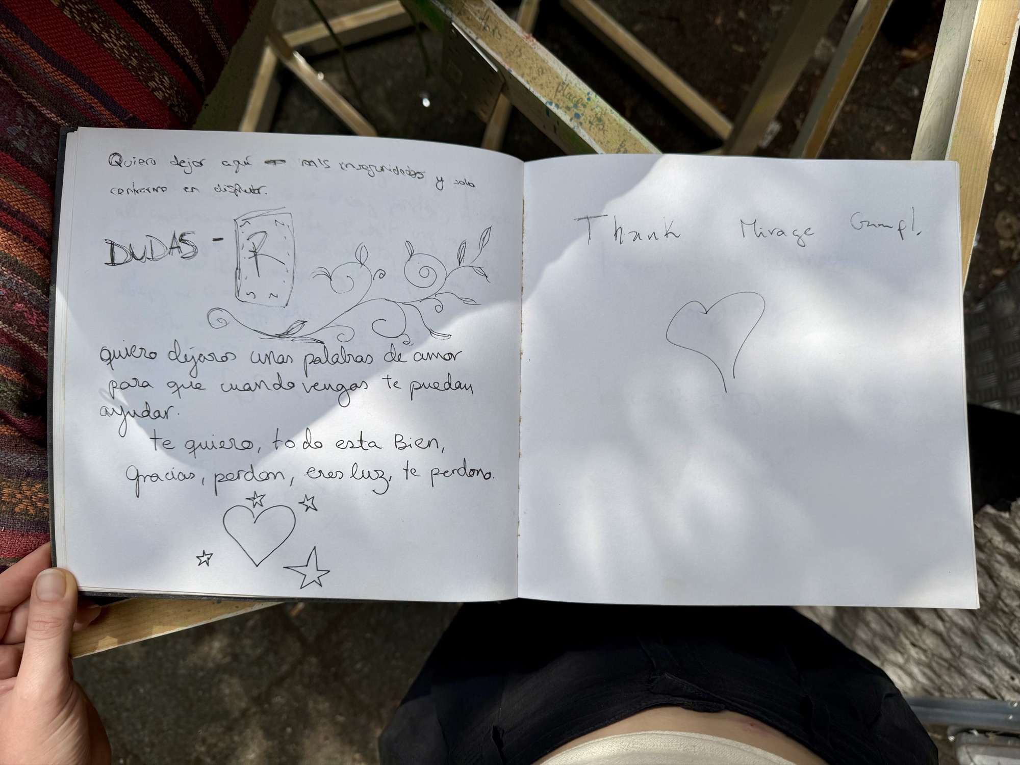A page from the book with handwritten messages from visitors