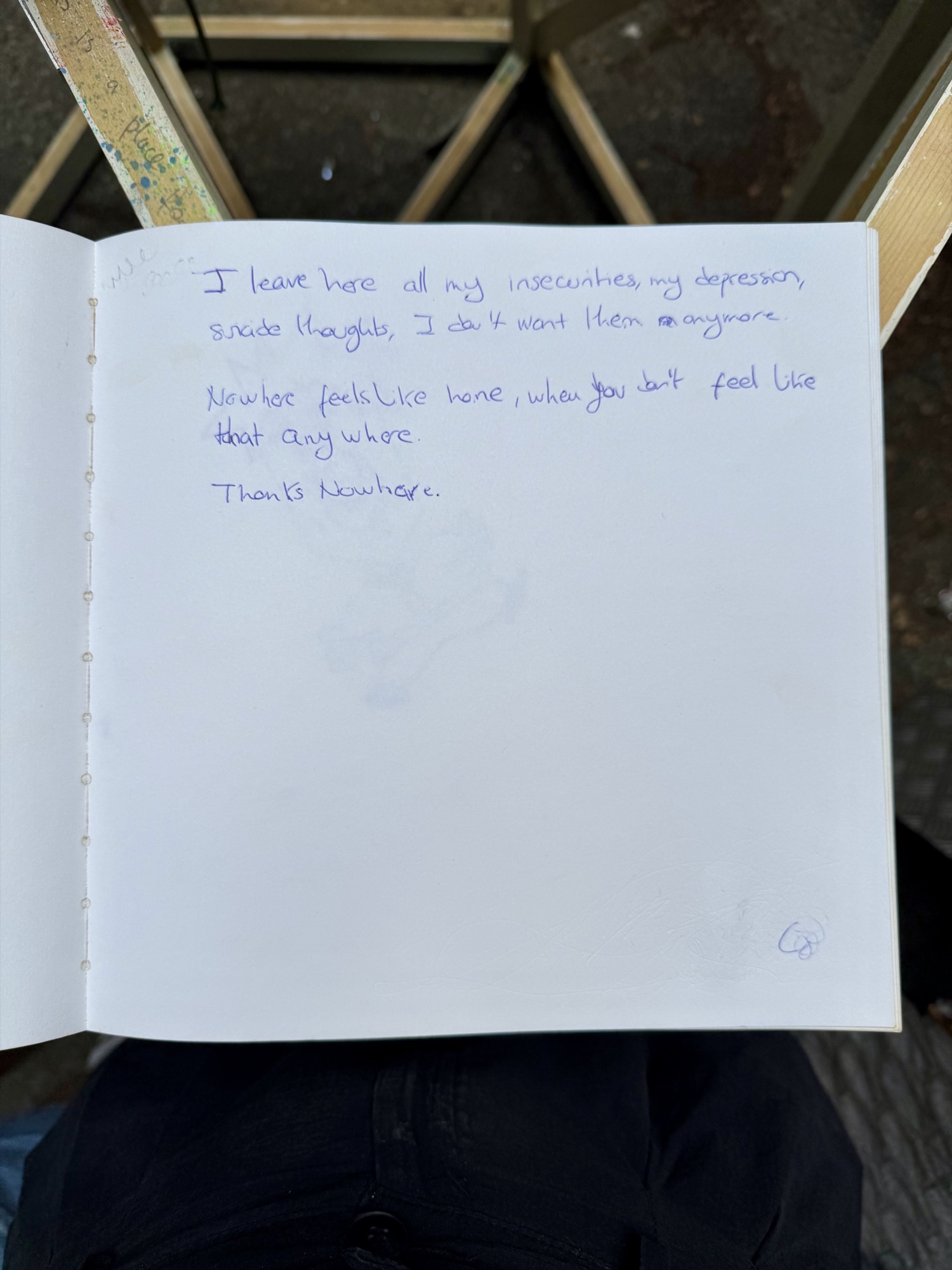 A page from the book with handwritten messages from visitors