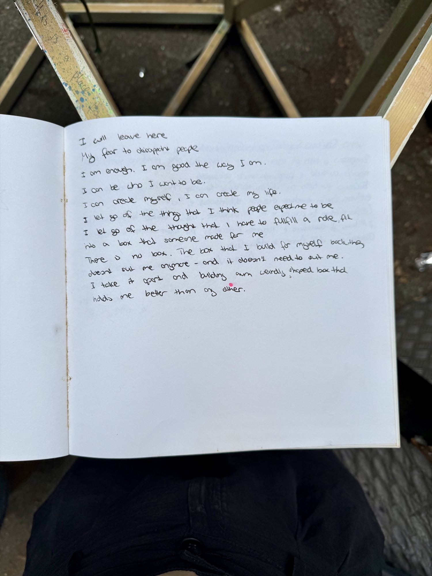 A page from the book with handwritten messages from visitors