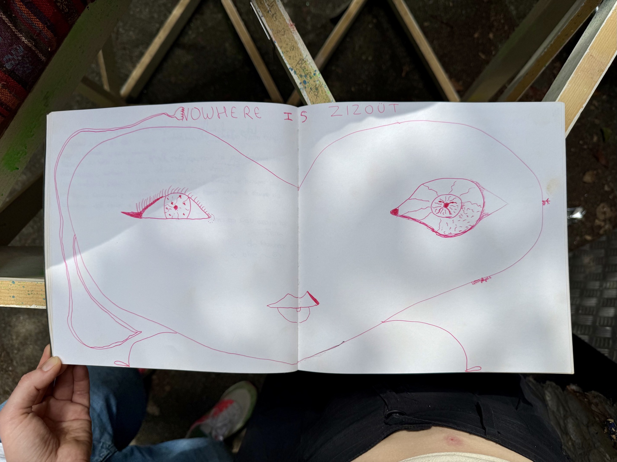 A page from the book with handwritten messages from visitors