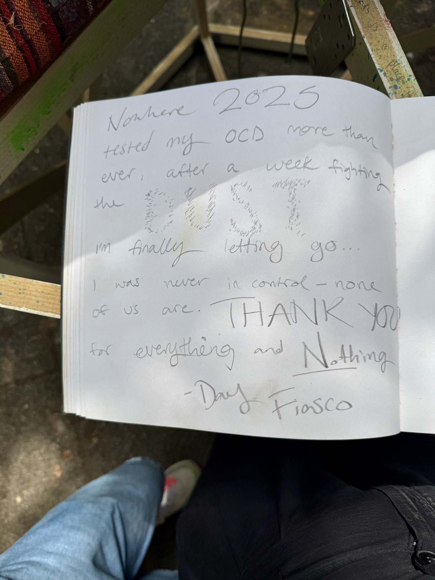 A page from the book with handwritten messages from visitors