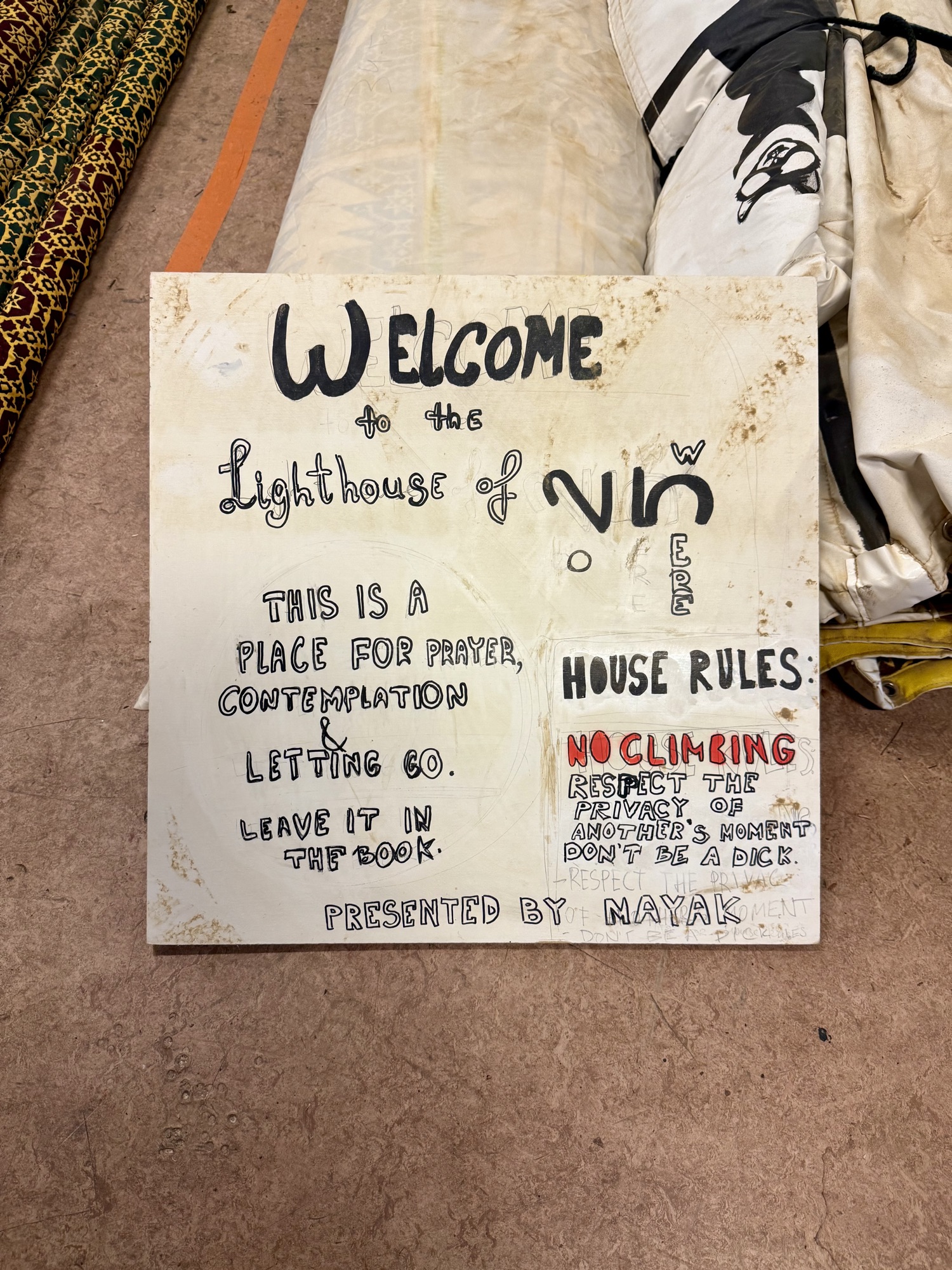"Welcome to the Lighthouse of Now Here" sign