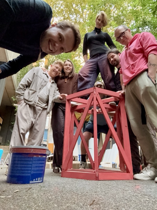 The team painting wooden parts