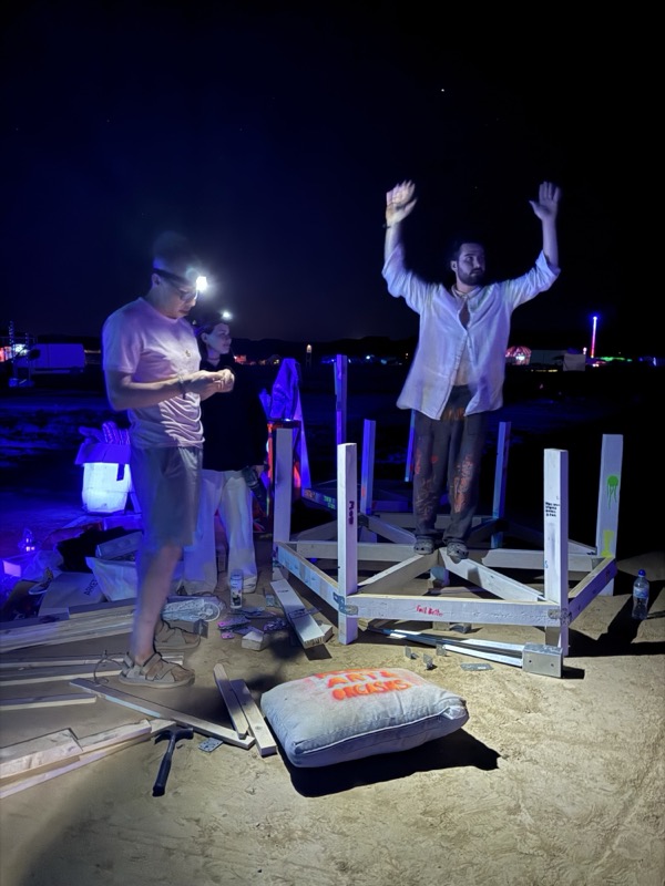 The team on the build site at night