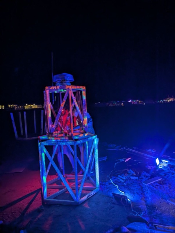The finished lighthouse lit at night