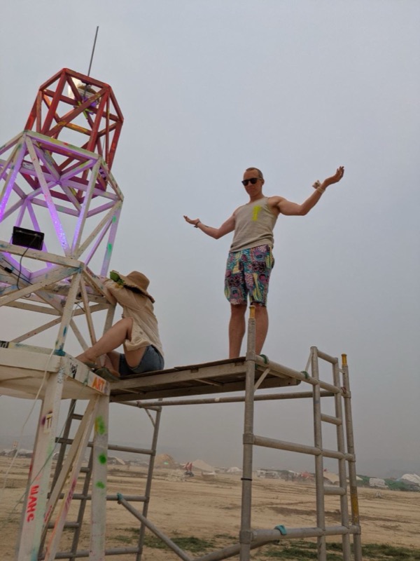 Celebrating on the scaffold beside the lighthouse