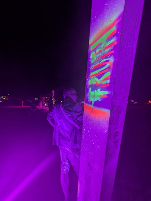 Glowing painted detail on the wooden frame
