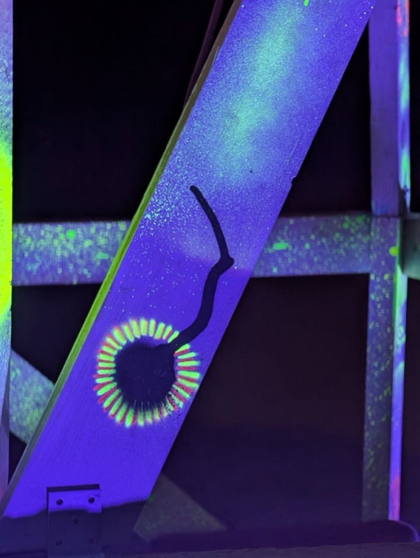 Glowing painted detail on the wooden frame