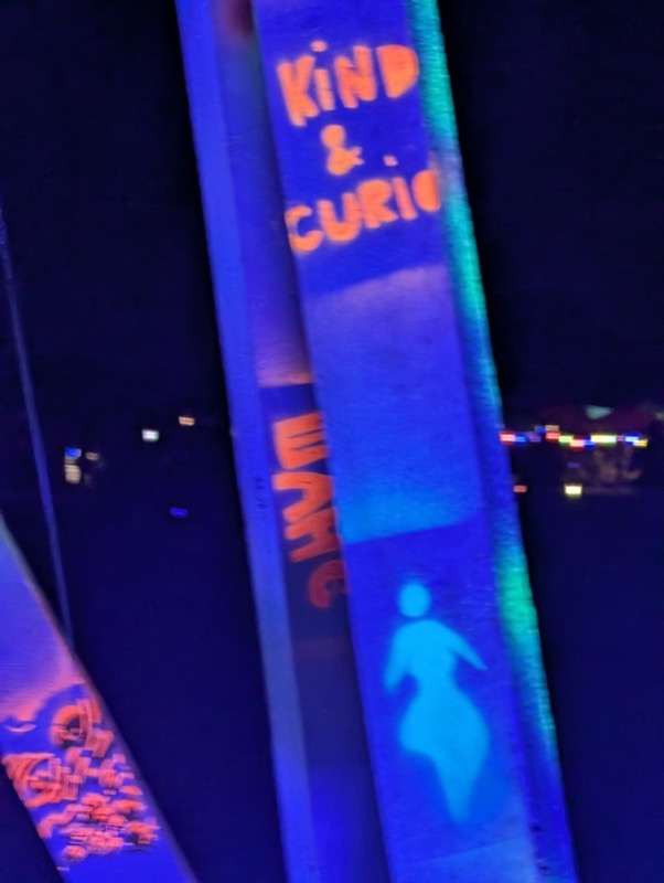 Painted lettering glowing under UV light