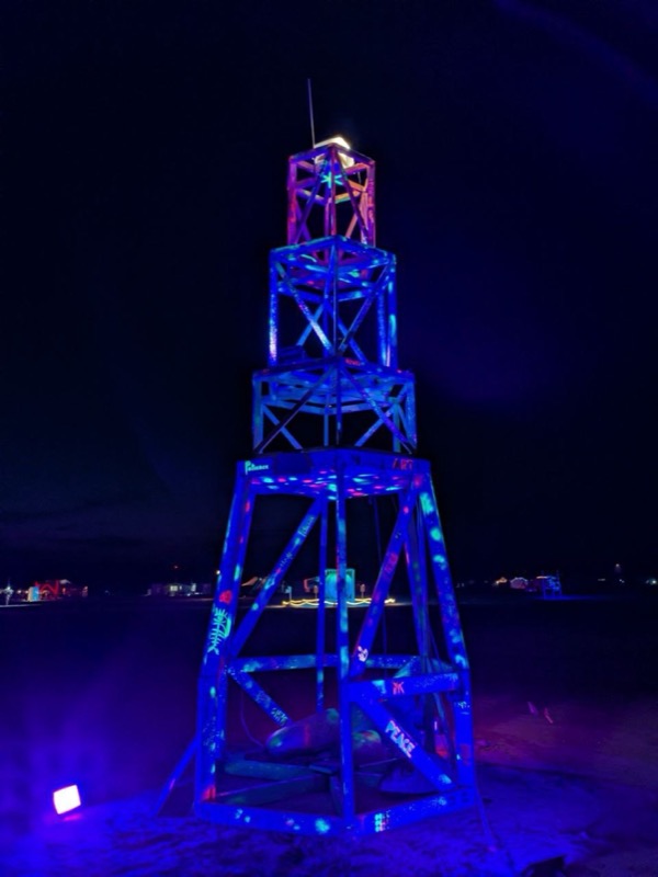 The lighthouse under UV light at night