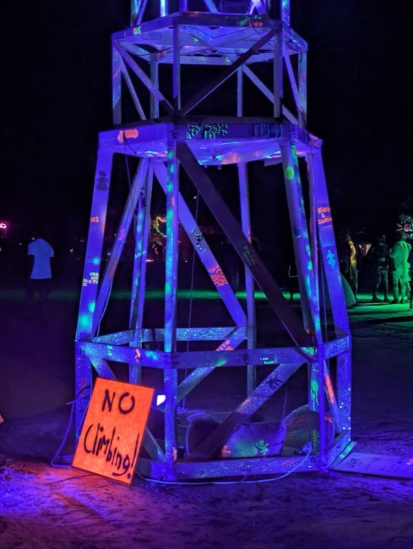 The base of the lighthouse glowing under UV light